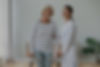 Elderly grandma holding walking frame feels satisfied after rehabilitation exercise therap