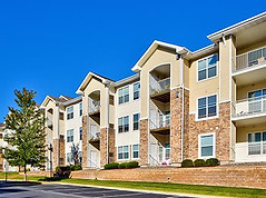 Apartment buildings view infront of a parking lot