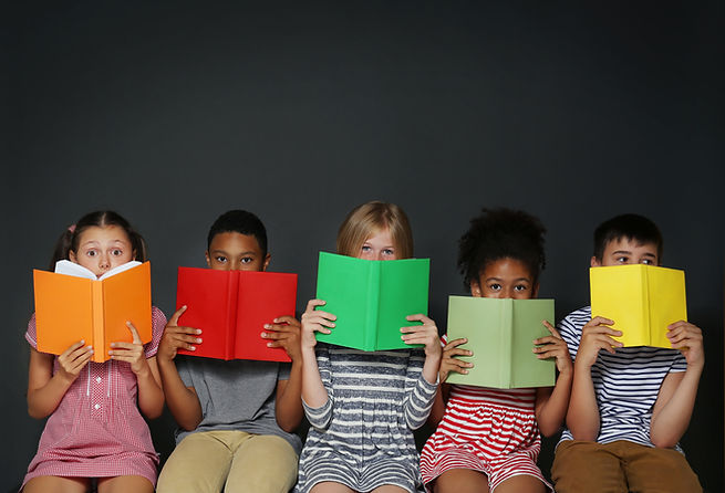 Cute kids reading books on grey background.jpg