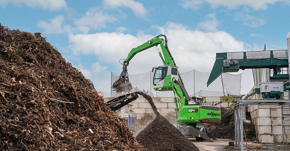 green mobile excavator recycling machine on waste business site