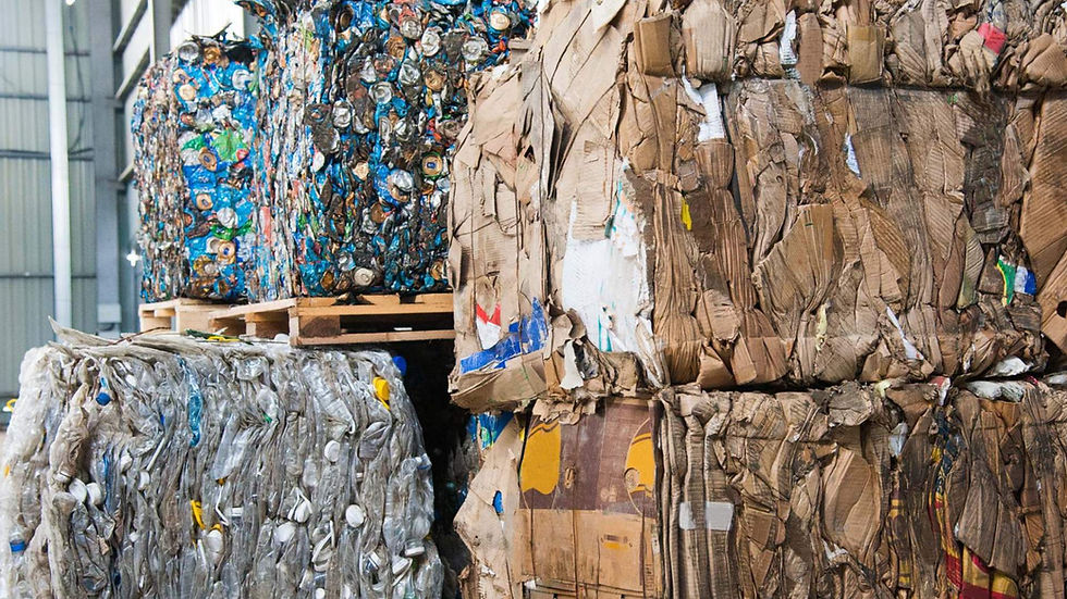 mixture of cardboard cans and bottle waste on pallets
