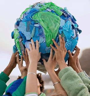 planet made of plastic held up by hands