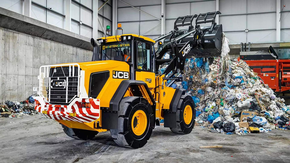yellow jcb moving waste in warehouse