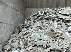 plasterboard-pile-in-warehouse-just-organised-for-transport-by-creative-waste-solutions-lt