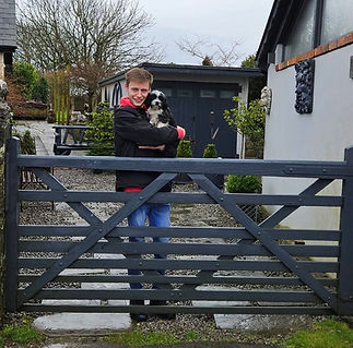 Elliott at gate with Groomed Dog.jpg
