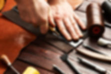 man-working-with-leather-2021-08-26-16-18-56-utc.jpg