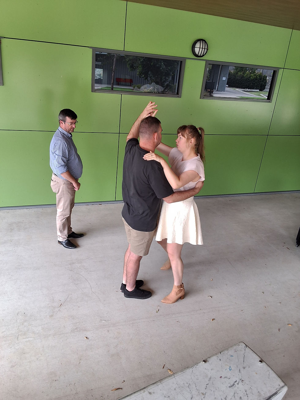 Wedding dance lesson filled with laughter and encouragement.