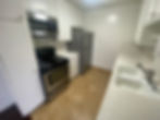Modern kitchen at 1025 S Holt apartments with appliances.