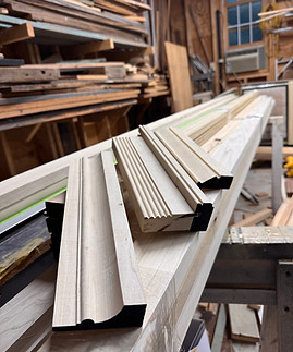 Custom wood molding profiles prepared in the Stafford Painting & Restoration workshop.