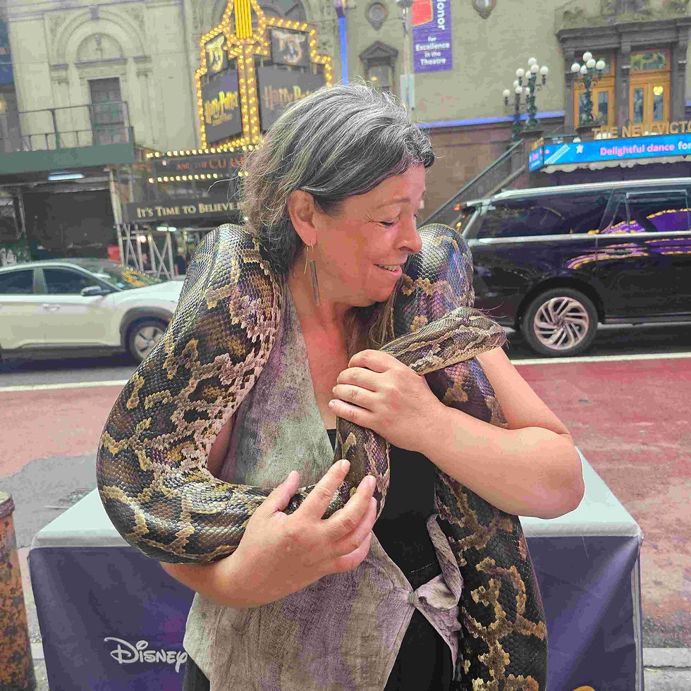 Sofia playing with a Snake at Times Square, New York City!