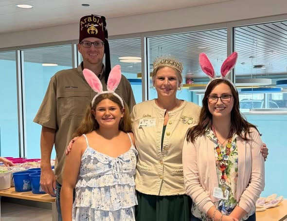 Eye-level view of a decorated Easter table with colorful treats and baskets