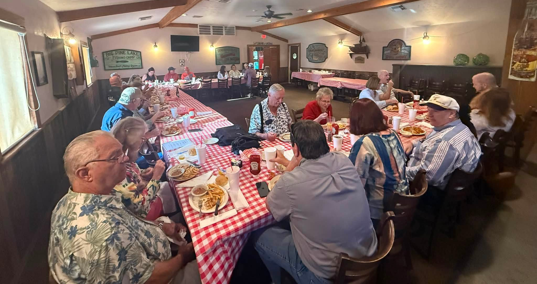 Wide-angle view of bowlers sharing a meal before the season begins.