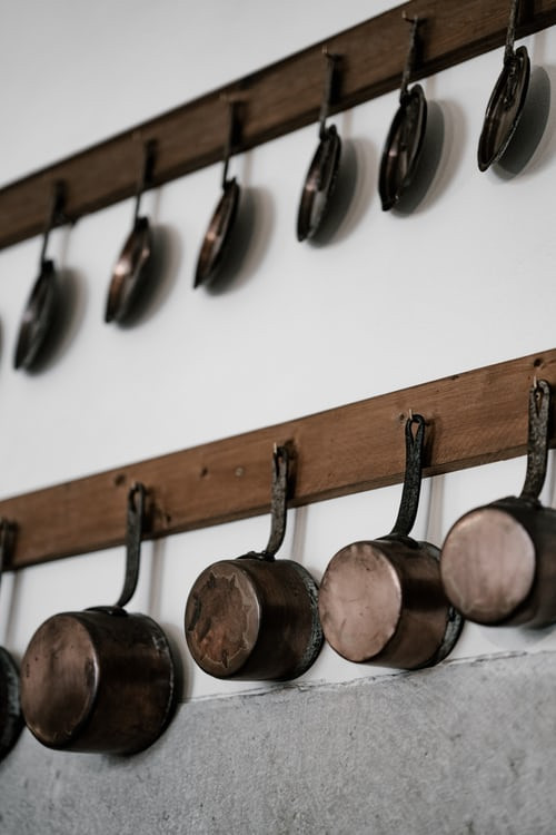 Pots and pans hanging on a wall