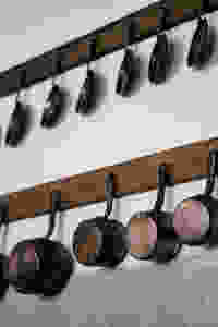 Pots and pans hanging on a wall
