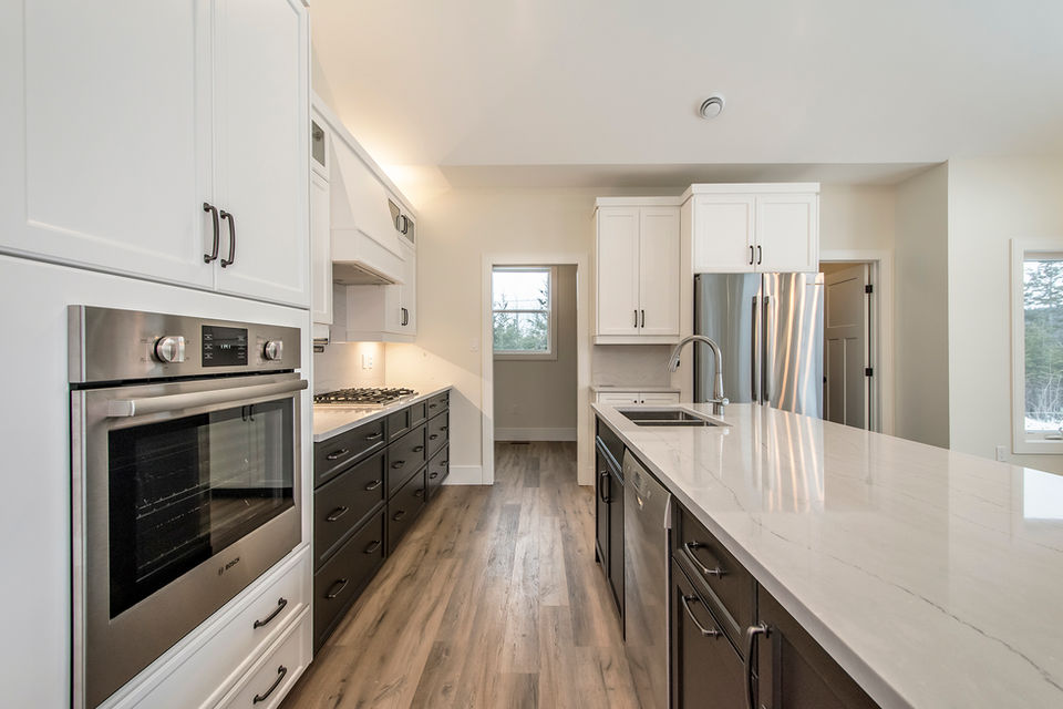 Kitchen interior in the Deermist Bungalow with Walkout built by JonesCo Builders