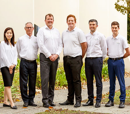 The Aspire2Wealth team smiling in a team photo.