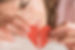 close-up-woman-holding-broken-heart_23-2