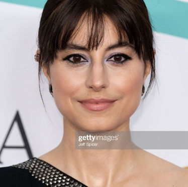 Zahra Ahmadi at the BAFTA Film Awards with red carpet makeup and a soft fringe