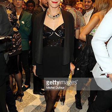 Sleek blonde hair and evening makeup at a London party
