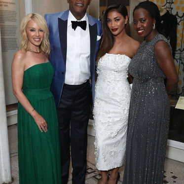 Guests in evening gowns at a London black tie event with glam makeup