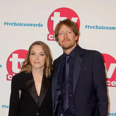 Couple on the TV Choice Awards red carpet with polished evening makeup and soft waves