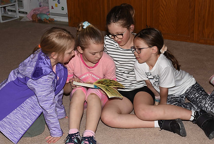 children reading students Holy Family School