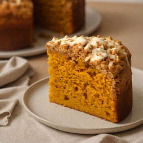 A cozy slice of sourdough pumpkin coffee cake topped with a buttery streusel crumb and a drizzle of glaze — the perfect fall bake for breakfast, brunch, or dessert.