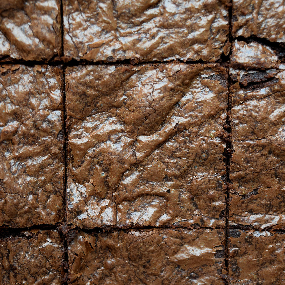 Fudgy sourdough discard brownies with shiny crackly tops cut into squares