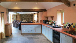 Conversion of an agricultural outbuilding into a cosy holiday cottage using breathable materials.