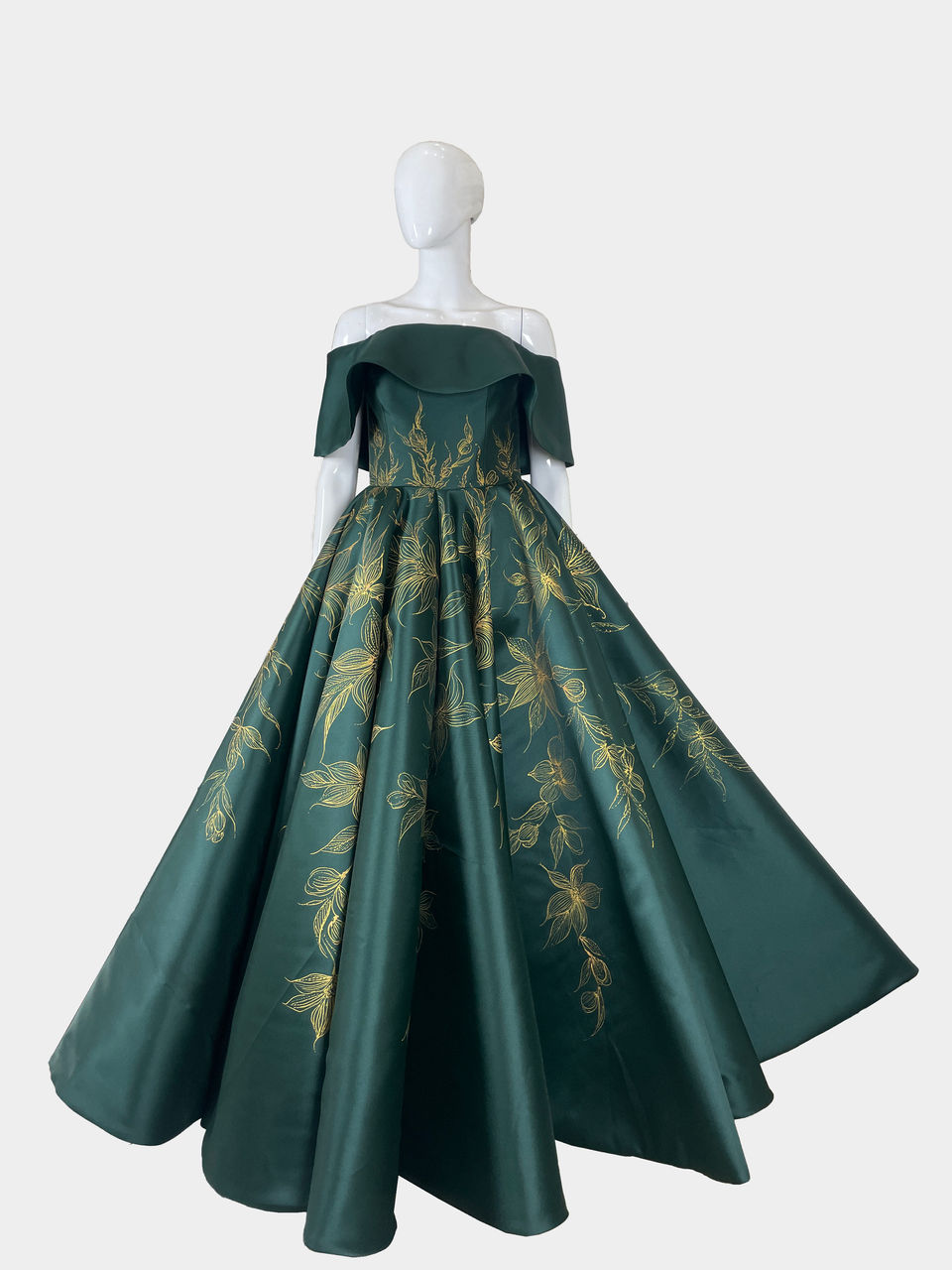 Emerald green off shoulder voluminous big ball gown with hand painted Gold Sundrop flower from tangled made by Alyssa de Guzman Couture shipped to a client in USA
