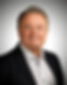Headshot of a man in a suit