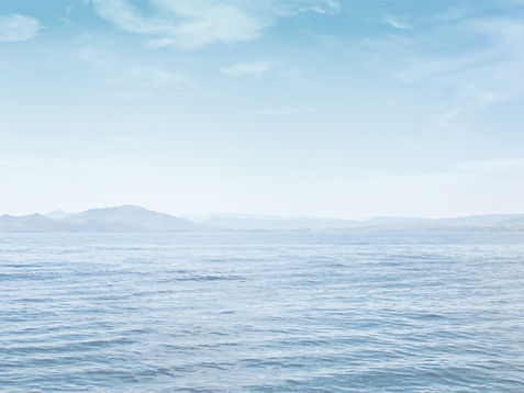 view on a lake with mountains in the back