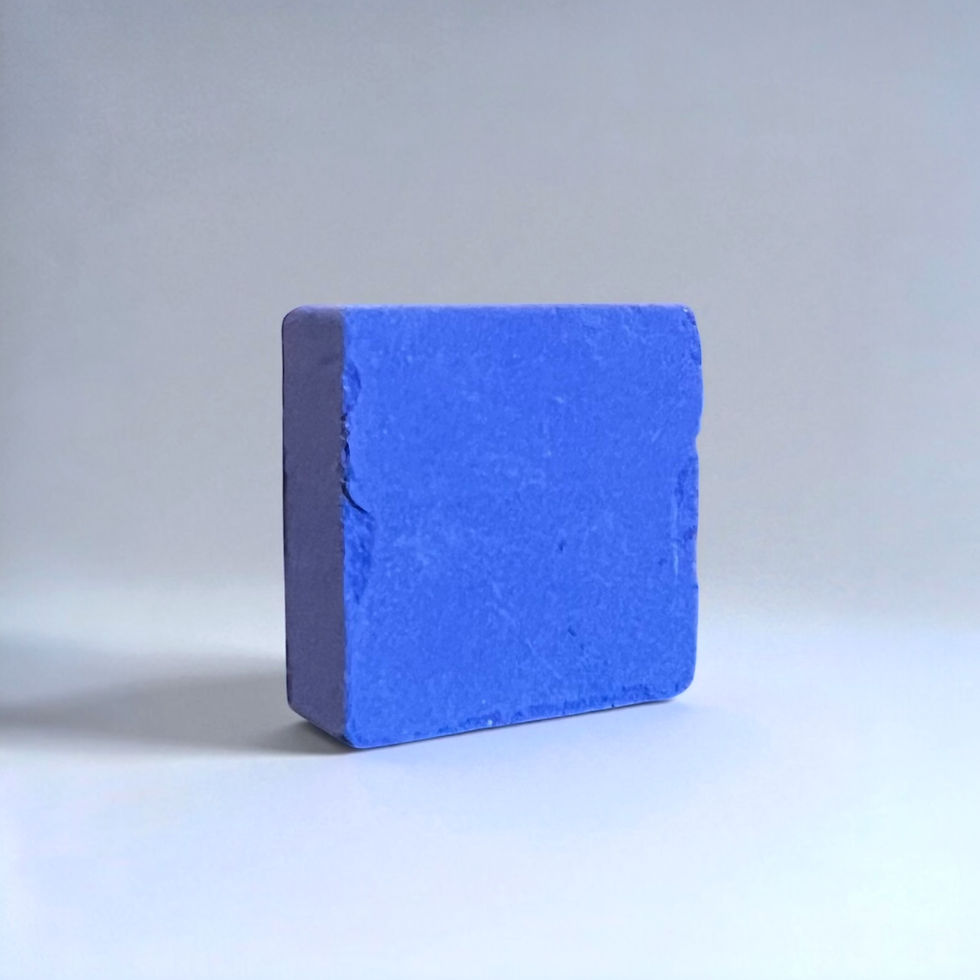 solid anil blue square block with a neutral gray background