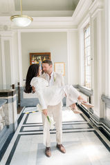 Groom holding bride in the air at Islington town hall wedding