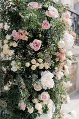 Pink floral arch taken by Chateau De Santeny Wedding Photographer