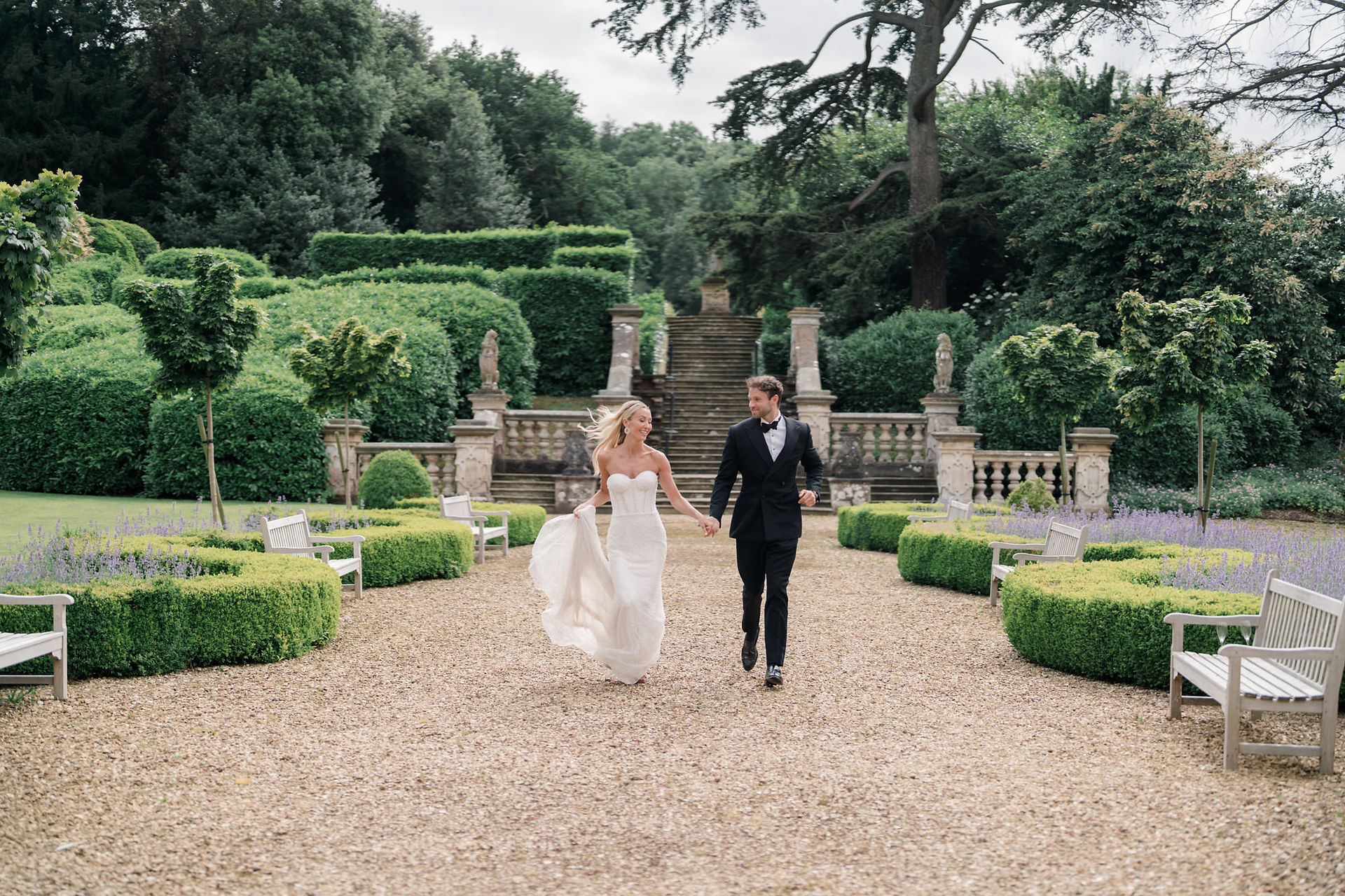 Bride and from running together through Harlaxton Manor gardens while looking at each other