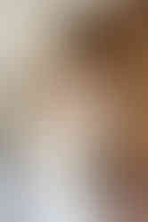 Groom putting arm around the bride at Avington wedding 