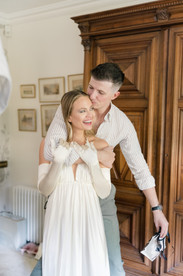 Groom putting arm around the bride at Avington wedding 