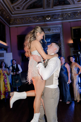 Groom lifting up bride on dance floor at Avington wedding 