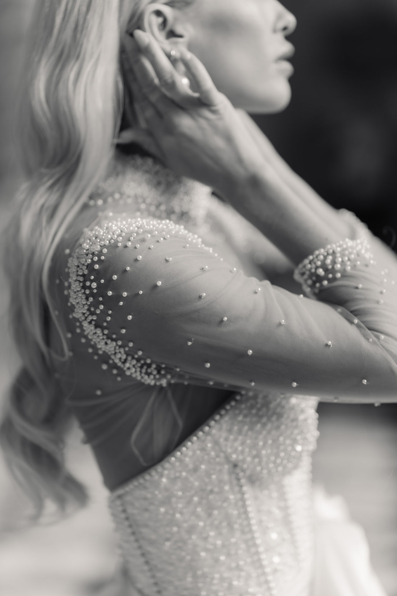 Close up of Brides dress showing bead detailing 