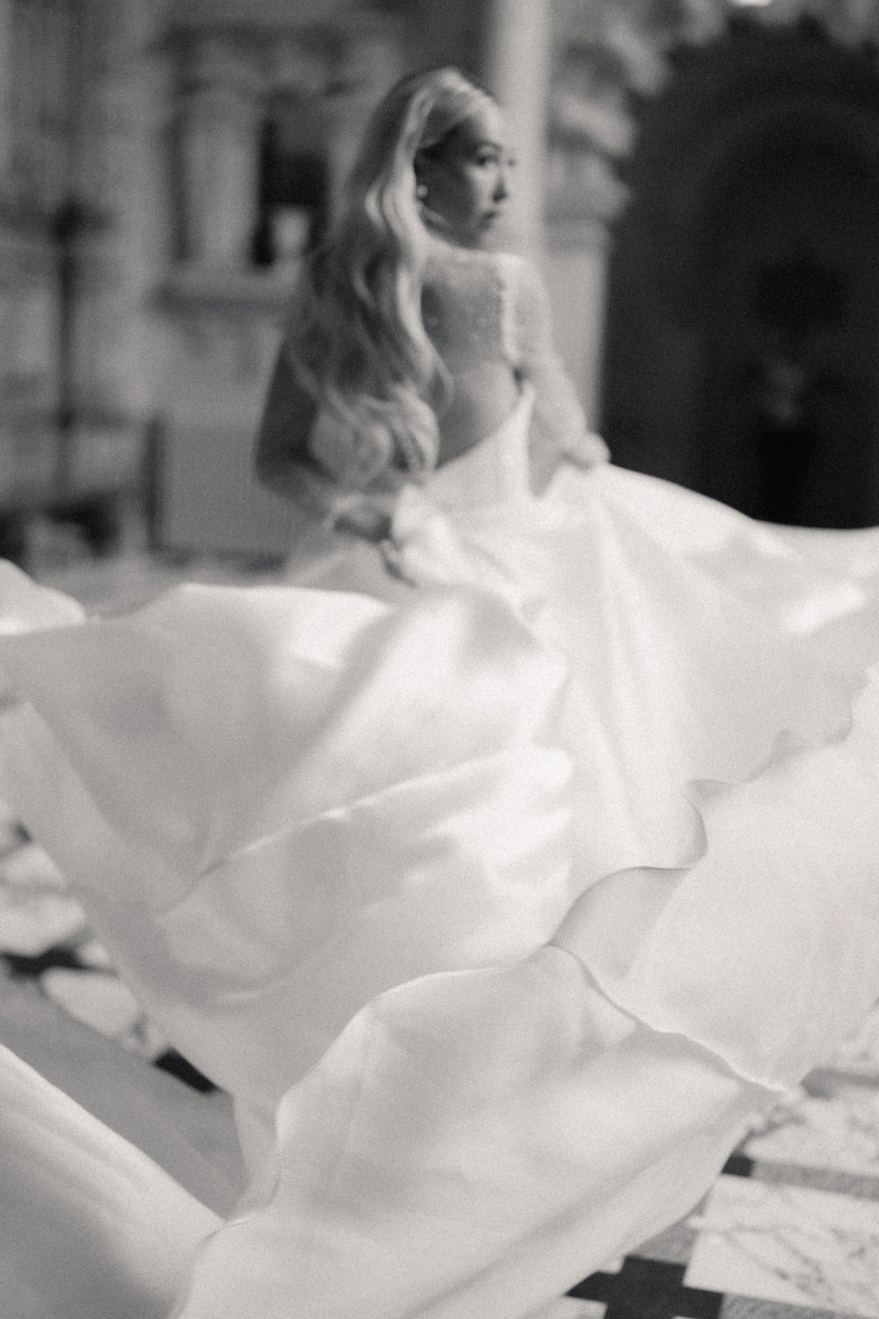 Artistic dress shot of wedding dress on bride