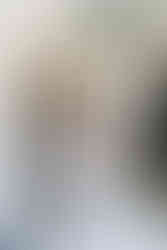 Bride and groom standing towards each other at Islington town hall wedding