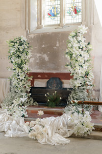 Elvetham hotel wedding with floral arch in the bell tower