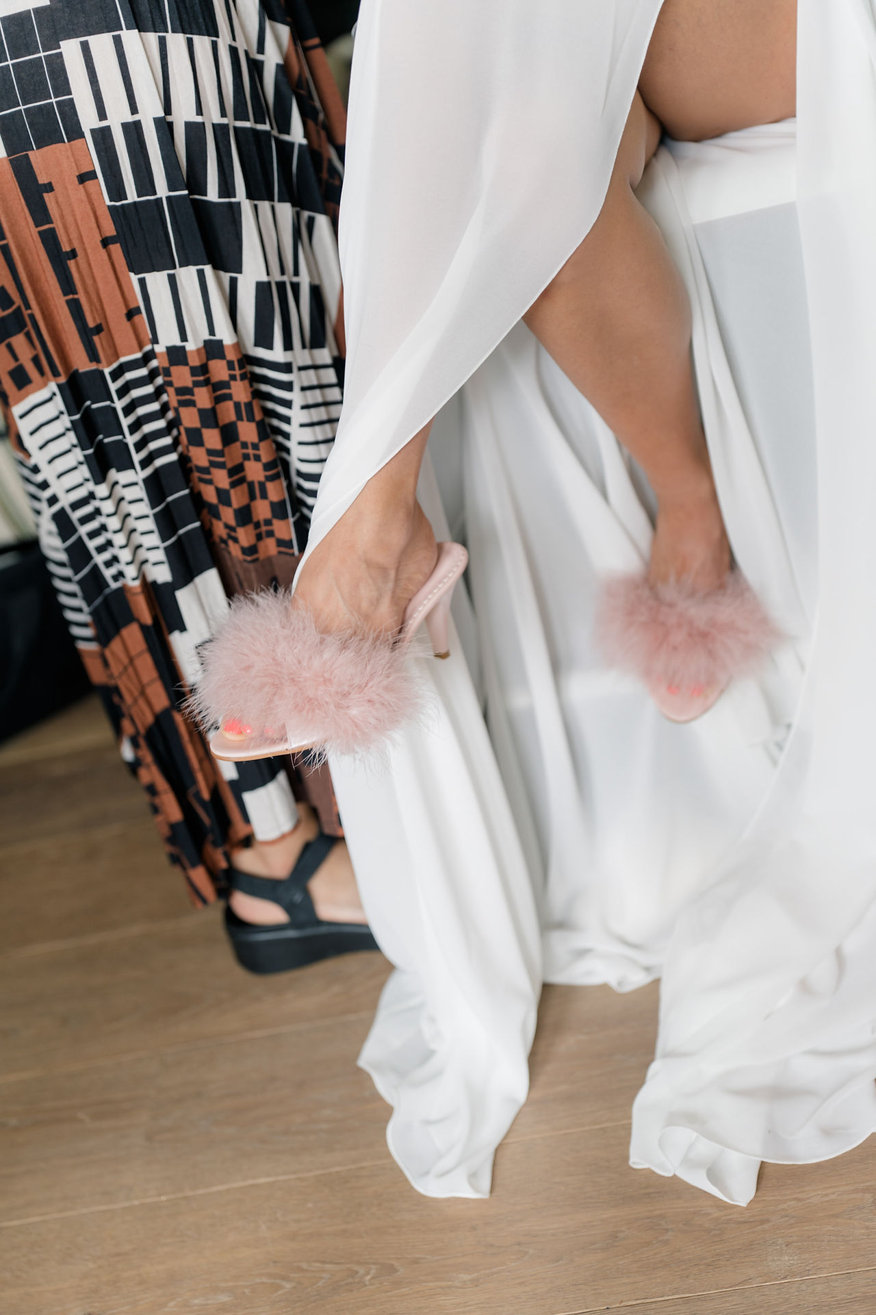 Brides pink fluffy slippers at Avington wedding 