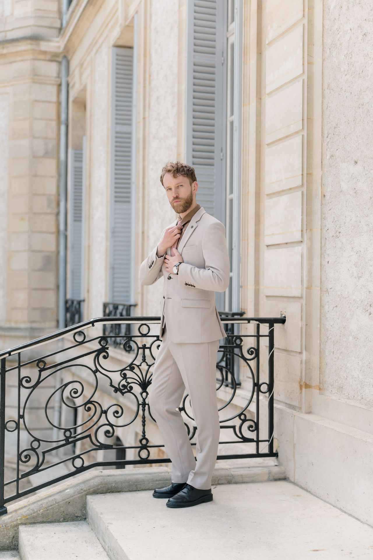 Groom posing for Chateau De Santeny Wedding Photographer