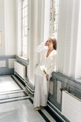 Bride standing in window posing at Islington town hall wedding