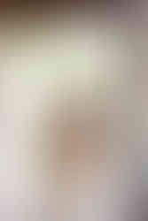 Avington wedding  with bride looking very happy holding her face