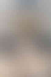 Bride and groom walking down stairs holding hands after Islington town hall wedding