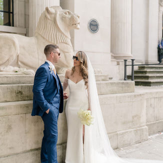 Bride and groom standing outside Marylebone Town Hall captured by London Wedding Photographer