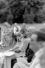 Wedding guest crying wiping tears at Avington wedding 